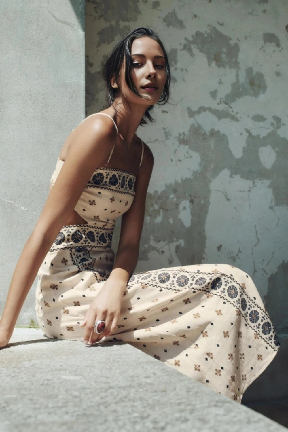 A-line dress featuring elegant embroidery and side cutouts, perfect for formal occasions. 2
