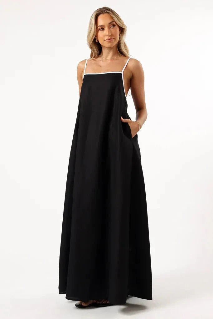 A-line midi dress with playful suspender straps, suitable for casual outings. 0