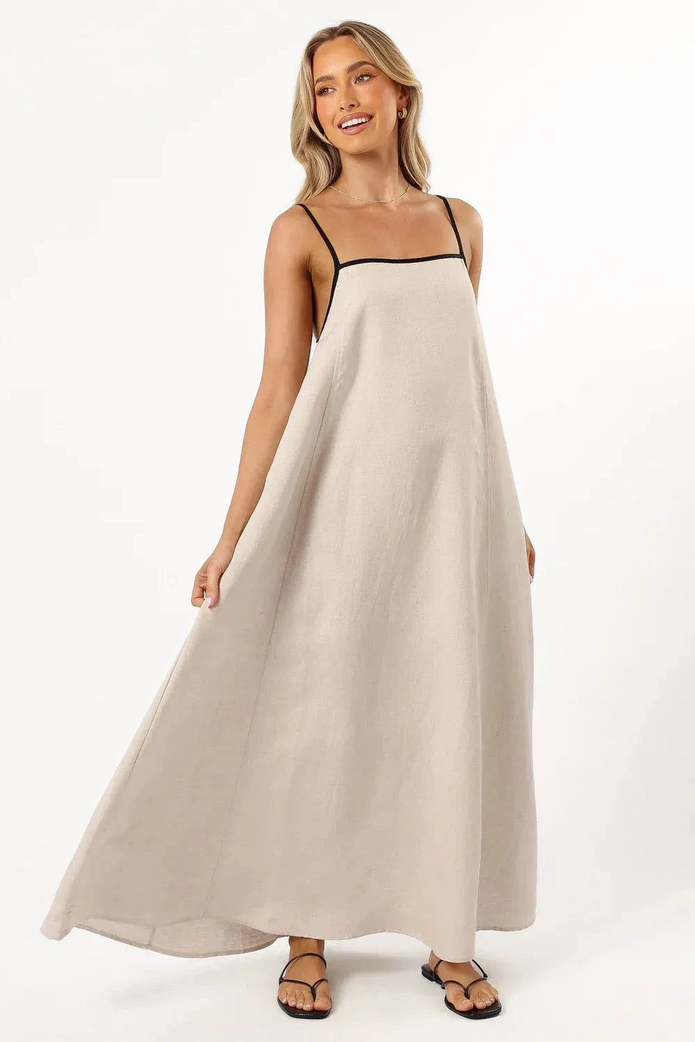 A-line midi dress with playful suspender straps, suitable for casual outings. 2