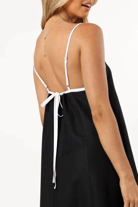 A-line midi dress with playful suspender straps, suitable for casual outings. 7