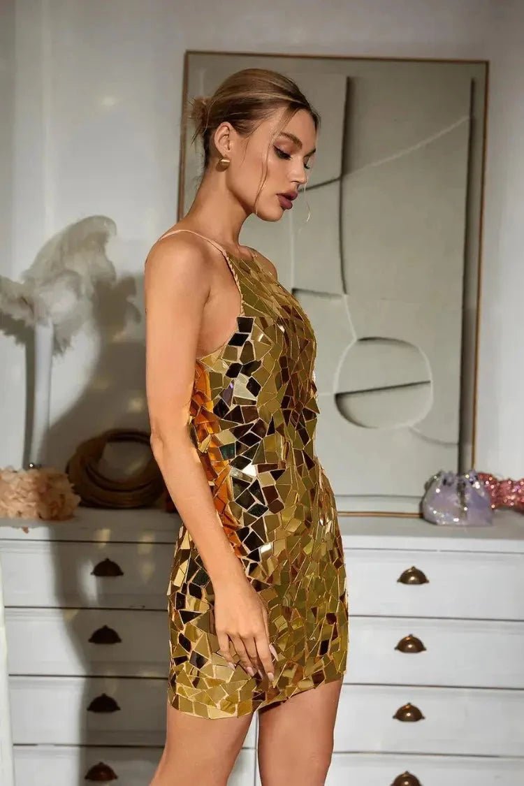 A stylish dress featuring eye-catching embellishments, designed with a flattering silhouette for elegant occasions. 3