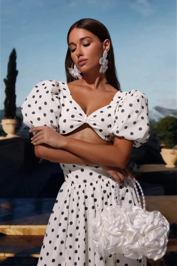 Chic two-piece outfit featuring a strapless top and fitted silhouette, perfect for formal events. 1