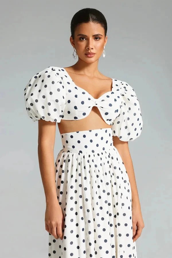 Chic two-piece outfit featuring a strapless top and fitted silhouette, perfect for formal events. 2