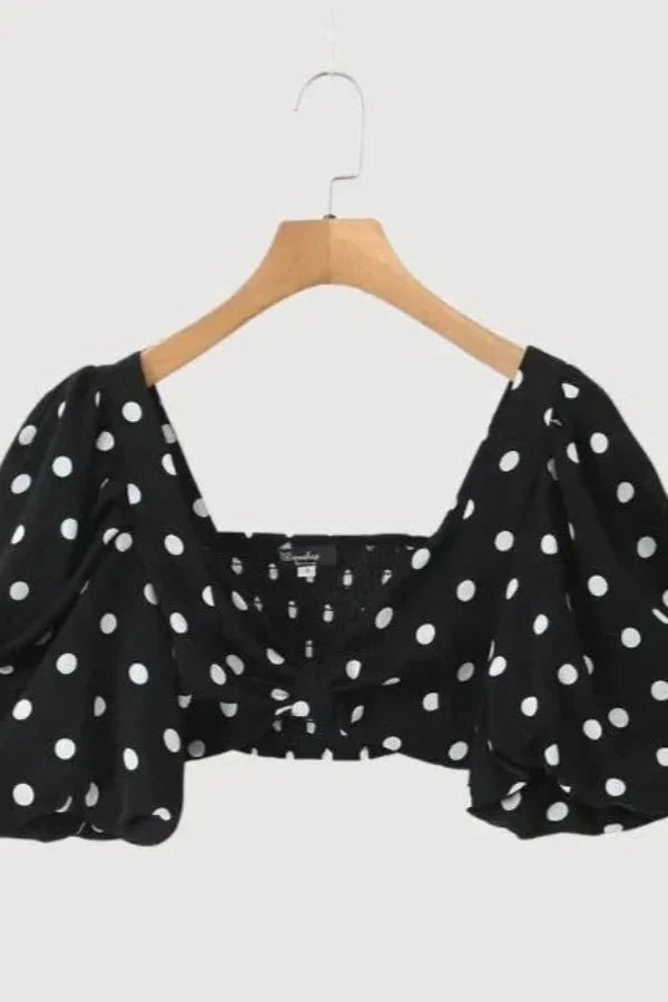 Chic two-piece outfit featuring a strapless top and fitted silhouette, perfect for formal events. 4