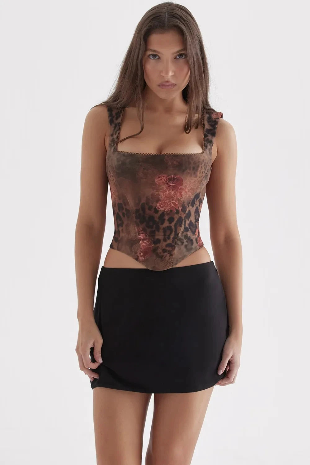 Corset top with playful polka dot design, fitted silhouette, suitable for casual outings. 3