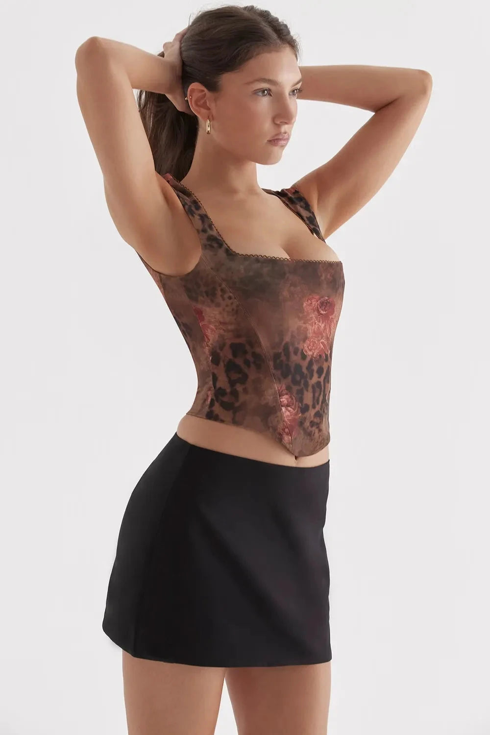 Corset top with playful polka dot design, fitted silhouette, suitable for casual outings. 6