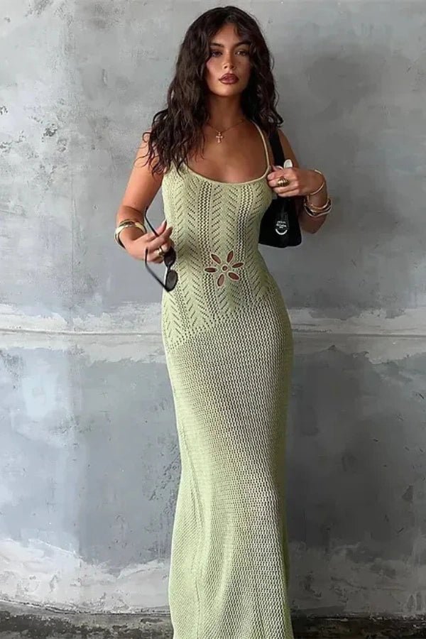 A flowing maxi dress with an elegant open-knit design, featuring a feminine silhouette suitable for formal occasions. 0