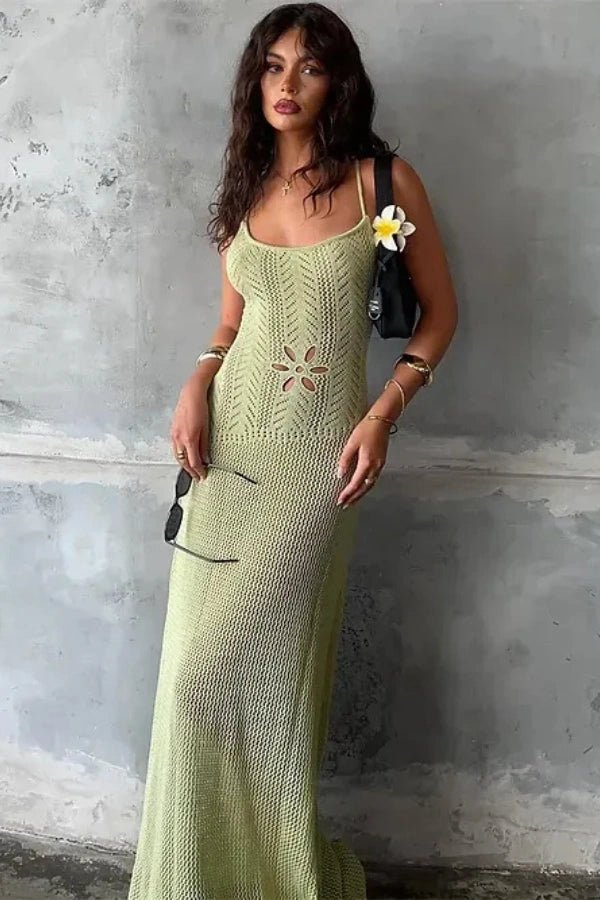 A flowing maxi dress with an elegant open-knit design, featuring a feminine silhouette suitable for formal occasions. 1
