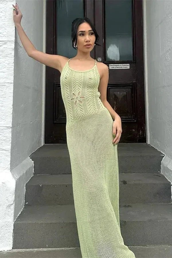 A flowing maxi dress with an elegant open-knit design, featuring a feminine silhouette suitable for formal occasions. 2