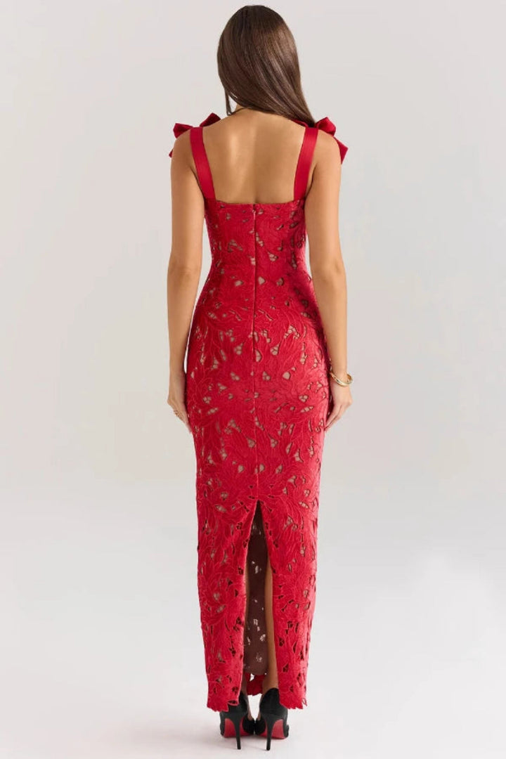 Elegant column gown featuring intricate lace detailing and statement bows, perfect for formal occasions. 5