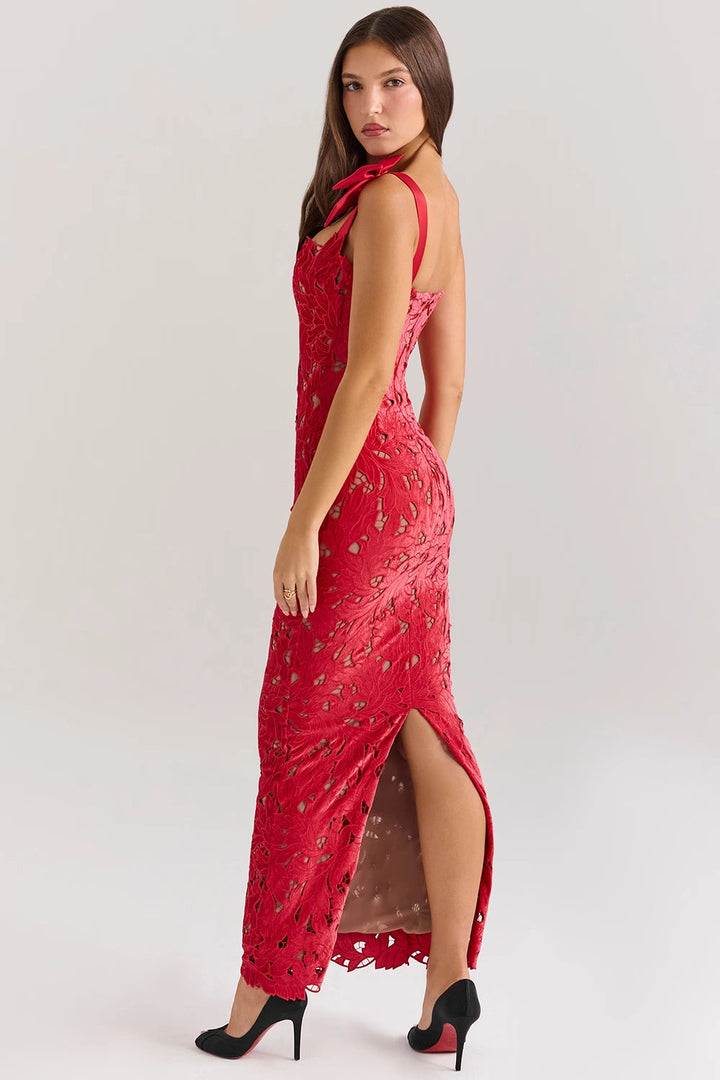 Elegant column gown featuring intricate lace detailing and statement bows, perfect for formal occasions. 6