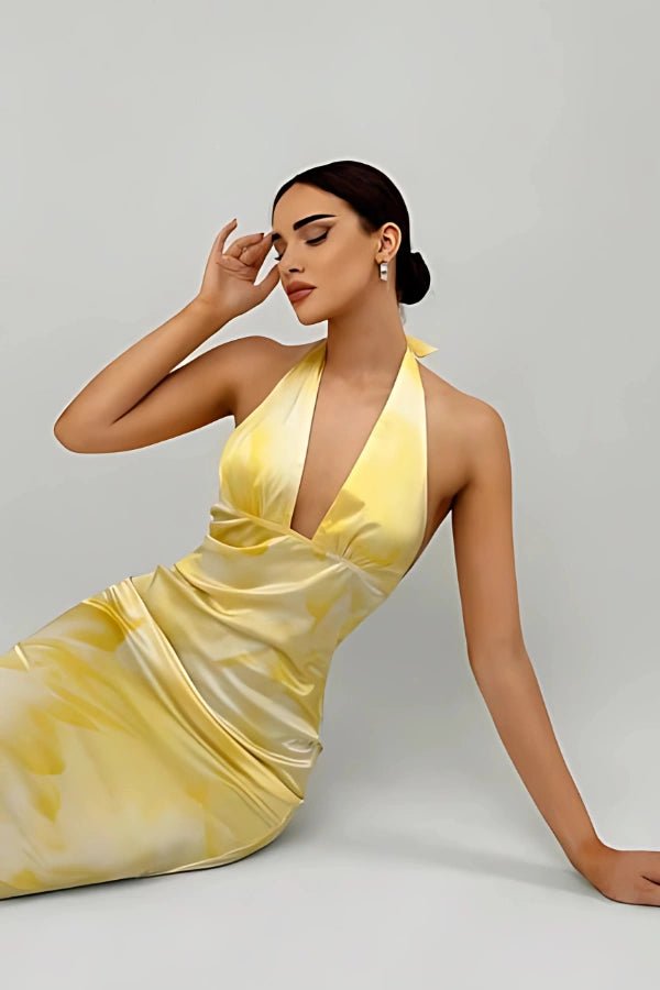 Elegant gown featuring a daring plunge neckline and a flowing silhouette, perfect for formal occasions. 0