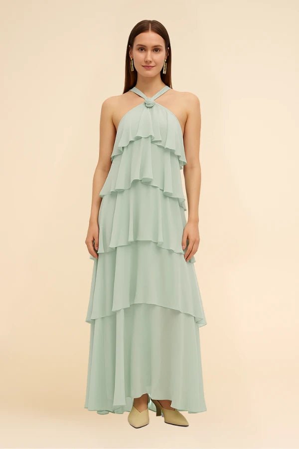 Elegant gown featuring a halter neckline and tiered design, perfect for formal occasions. 9