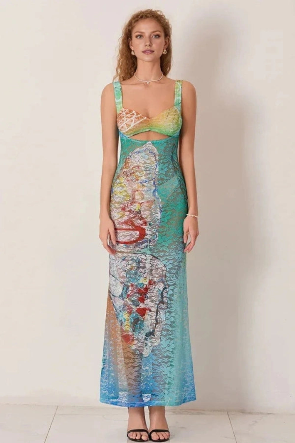 Elegant gown featuring an intricate floral design in a flowing silhouette, perfect for formal occasions. 1