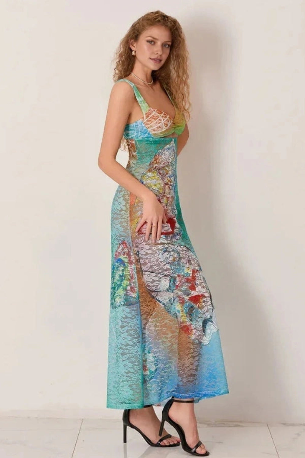 Elegant gown featuring an intricate floral design in a flowing silhouette, perfect for formal occasions. 3