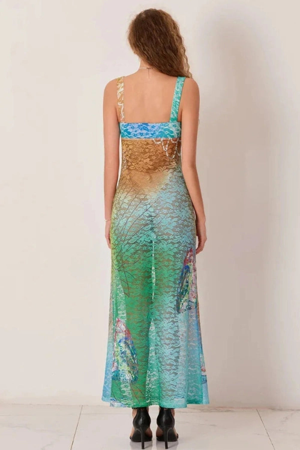 Elegant gown featuring an intricate floral design in a flowing silhouette, perfect for formal occasions. 4