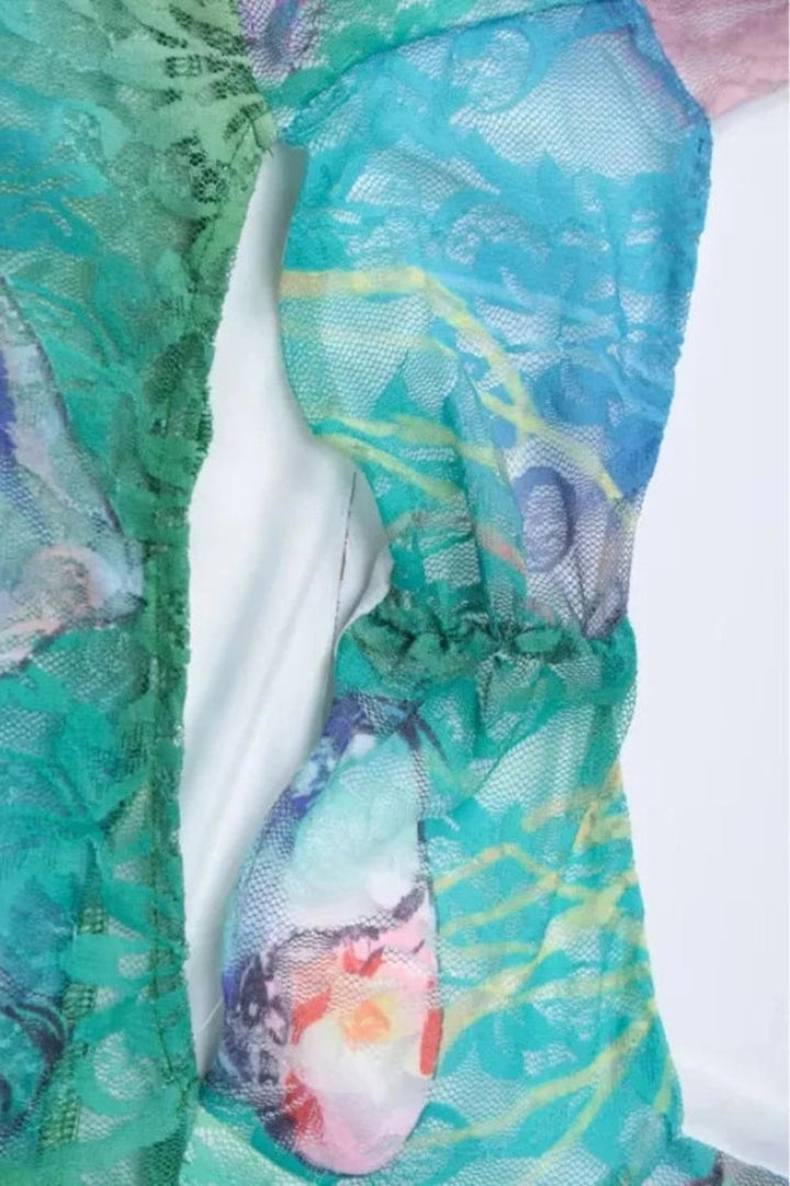 Elegant gown featuring an intricate floral design in a flowing silhouette, perfect for formal occasions. 6