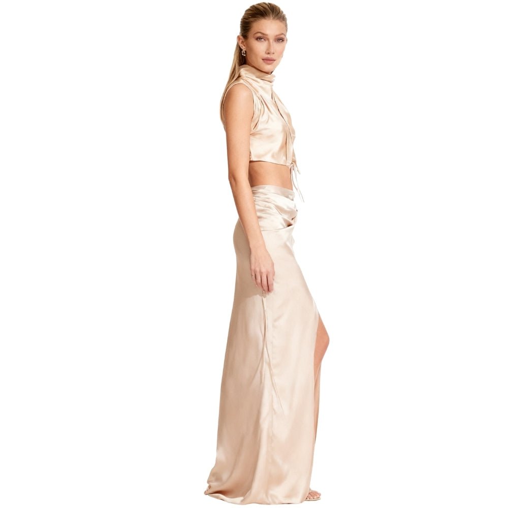 An elegant maxi dress featuring an open back design, perfect for formal events. 1