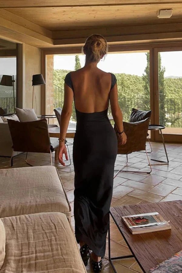 Elegant midi dress featuring a fitted silhouette, bateau neckline, and open back, perfect for formal occasions. 3