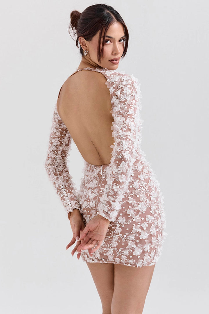 Elegant midi dress with a dramatic open back, tailored for sophisticated occasions. 1