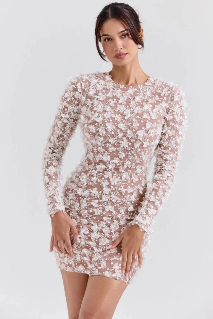 Elegant midi dress with a dramatic open back, tailored for sophisticated occasions. 3