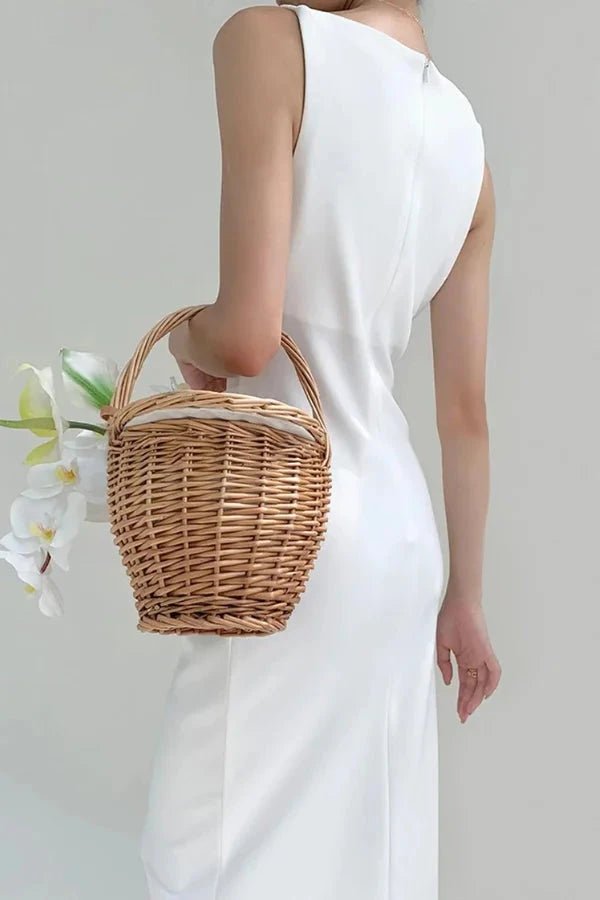 Elegant midi dress with a flowy silhouette, featuring a sleeveless straight neck design, perfect for formal occasions. 2