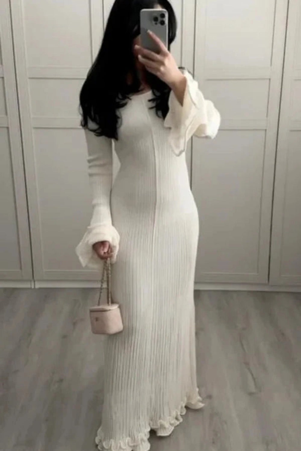 Midi dress with ruffled cuffs and a body-skimming silhouette, perfect for formal occasions. 2
