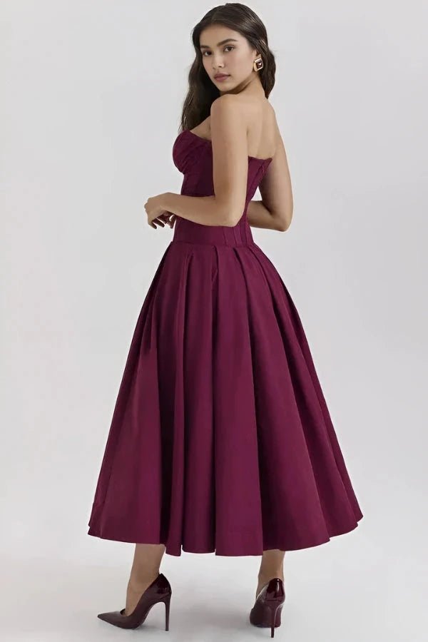 Elegant midi dress featuring a sculpted bodice and a voluminous skirt, perfect for formal occasions. 9