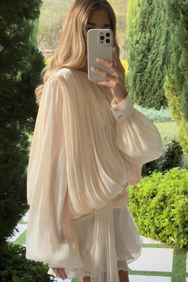 Elegant midi dress with sculpted sleeves and a cinched waist, perfect for formal occasions. 1