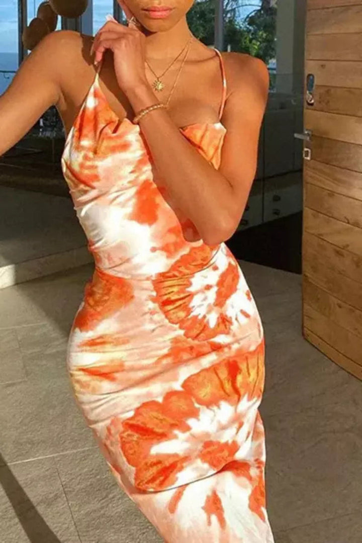 Elegant midi dress featuring a flowing silhouette, perfect for casual outings or summer events. 1