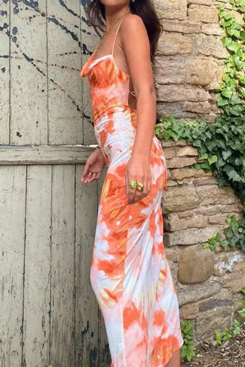 Elegant midi dress featuring a flowing silhouette, perfect for casual outings or summer events. 2
