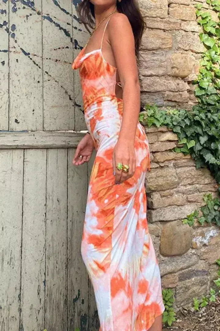 Elegant midi dress featuring a flowing silhouette, perfect for casual outings or summer events. 2