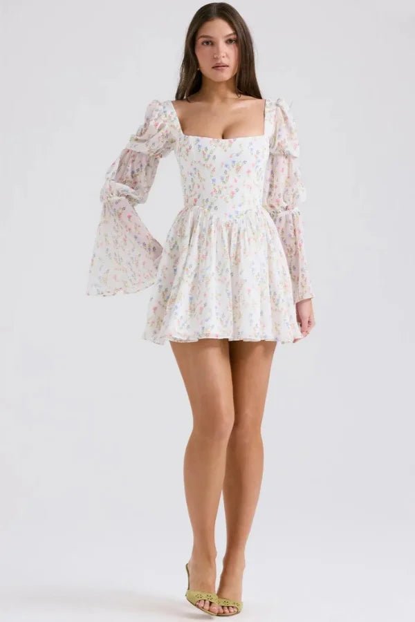Elegant midi dress featuring a tiered design and floral print, perfect for formal events. 1