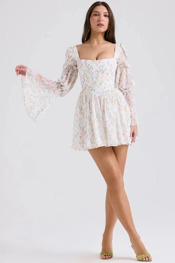 Elegant midi dress featuring a tiered design and floral print, perfect for formal events. 3