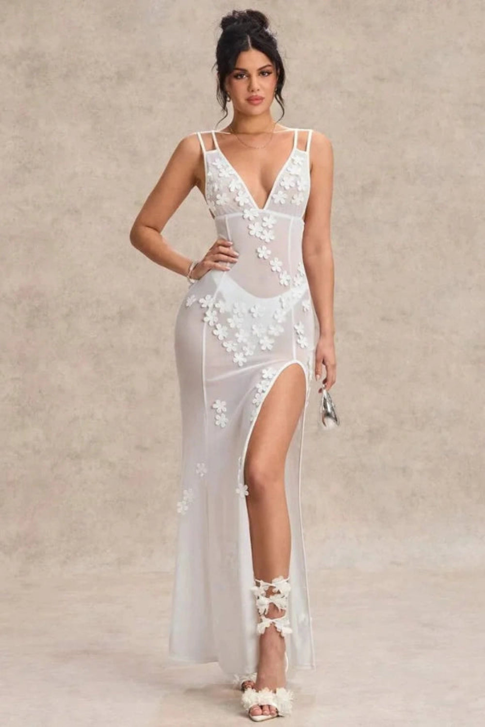 Floral gown with a deep V-neck and thigh-high slit, perfect for formal occasions. 0