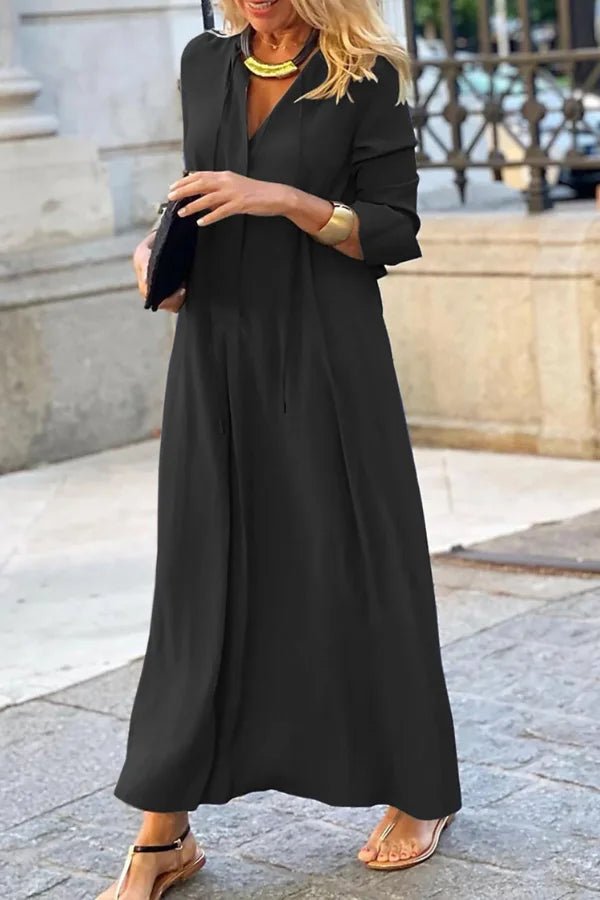 Maxi dress with a flowy silhouette, featuring an elegant long floral design, suitable for formal occasions. 0