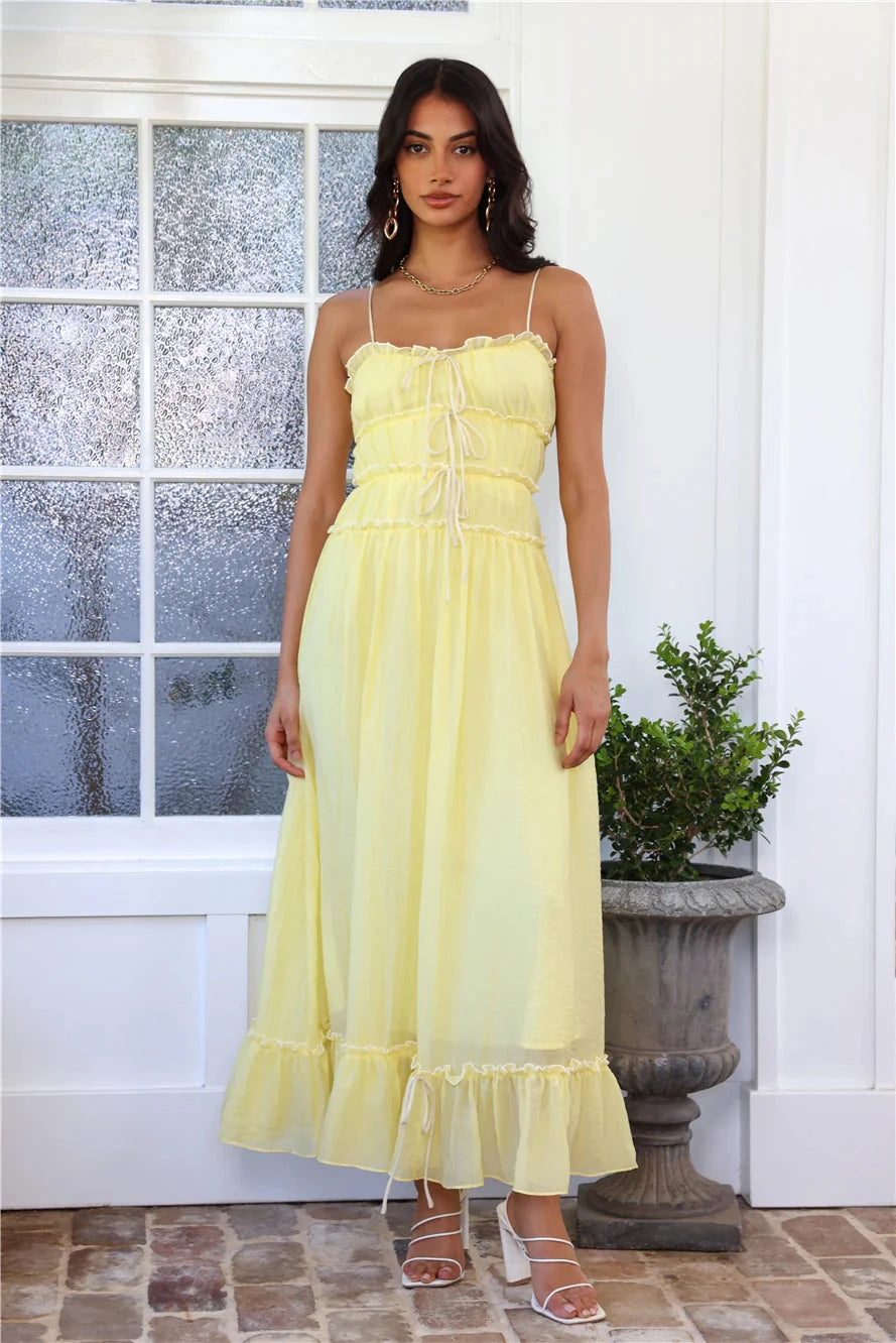 Maxi dress featuring a flowy skirt and frill design, perfect for a casual outing. 0