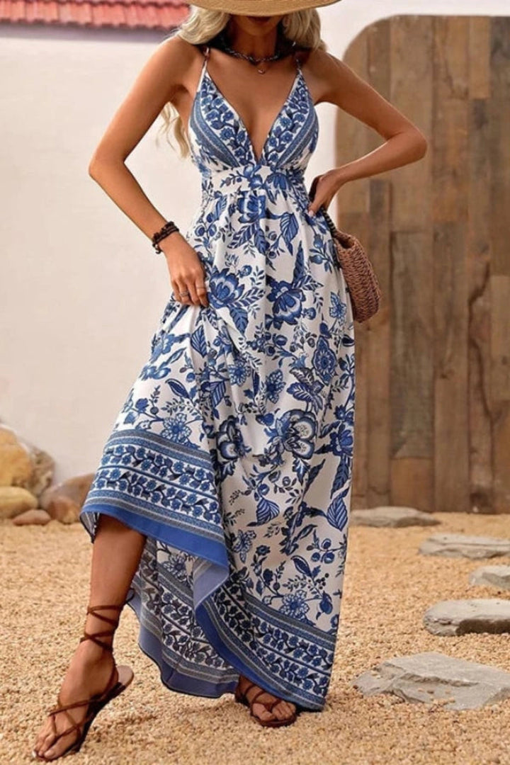 Maxi dress with a plunging neckline and open back, featuring a flowing silhouette suitable for formal occasions. 1