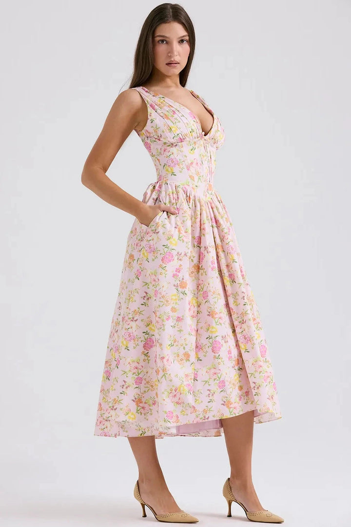 A midi sundress featuring a bold tropical print in a flowing silhouette, perfect for summer outings. 7