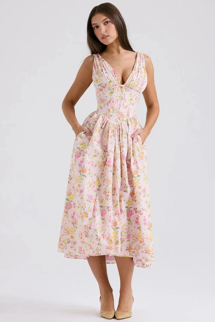 A midi sundress featuring a bold tropical print in a flowing silhouette, perfect for summer outings. 8