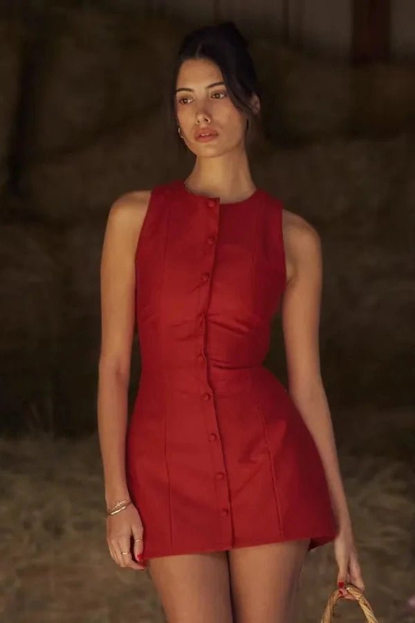 A mini dress featuring a button front design, with a fitted silhouette, suitable for casual outings. 1