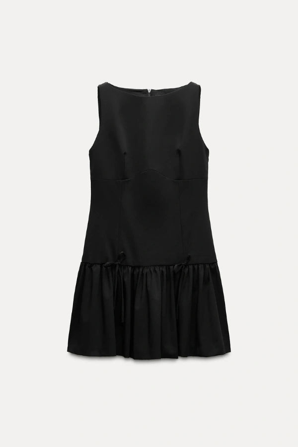 Mini dress with a ruffle design and bow, featuring a fitted silhouette, suitable for casual outings or summer events. 10
