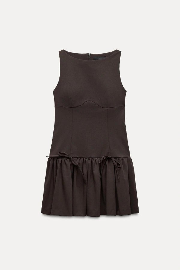 Mini dress with a ruffle design and bow, featuring a fitted silhouette, suitable for casual outings or summer events. 7