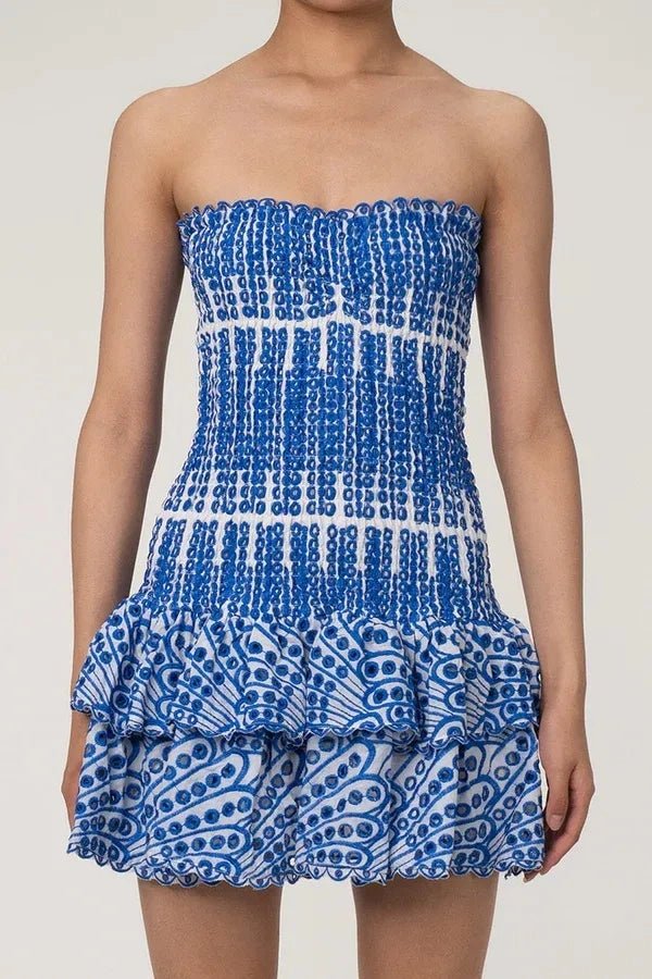 Strapless bodycon mini dress featuring intricate embroidery, perfect for a night out. 1