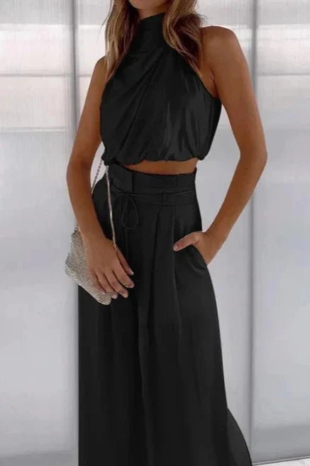 Sleeveless top with a relaxed silhouette paired with wide-leg pants, perfect for summer outings. 0