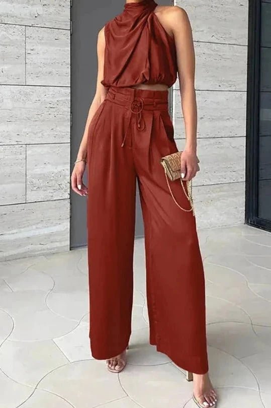 Sleeveless top with a relaxed silhouette paired with wide-leg pants, perfect for summer outings. 2