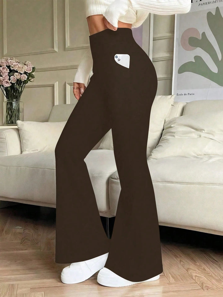 High-waisted flared jeans with a fitted silhouette, suitable for casual outings. - 1